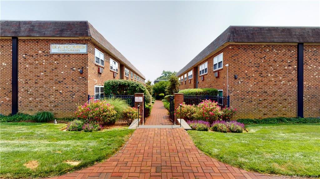 637 Cove Road, Unit D7 Stamford, CT 06902 - Photo 1 of 1 a view of a pathway both side of the house