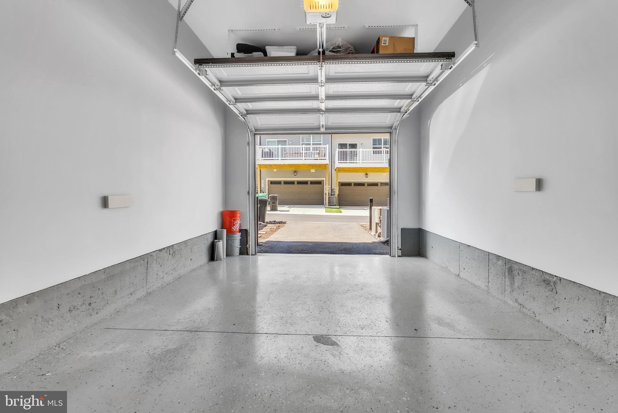 9524 Fields Road Gaithersburg, MD 20878 - Photo 54 of 61 Above auto door - built-in storage