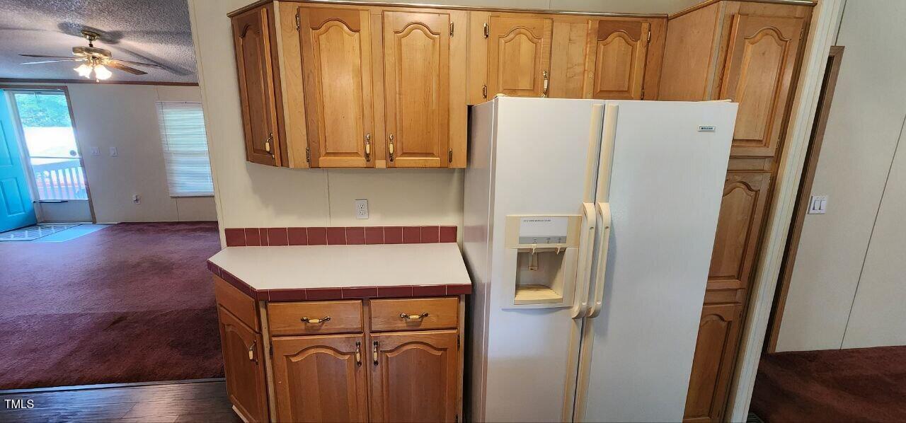 4470 Thomas Road Henderson, NC 27537 - Photo 8 of 21 a utility room with wooden floor and washing machine