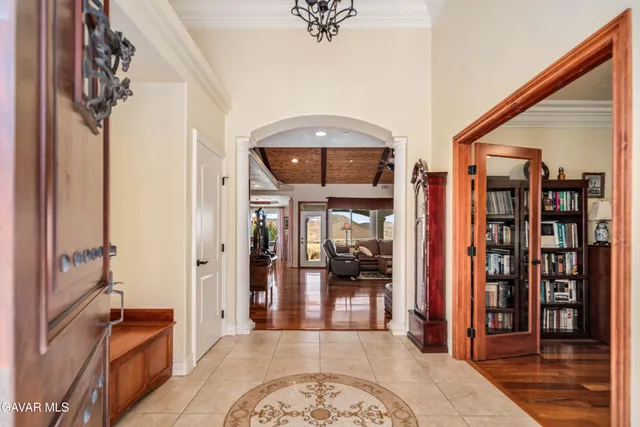 a kitchen with stainless steel appliances granite countertop a kitchen island a table and chairs in it