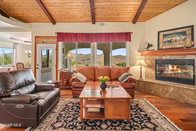 a spacious bedroom with a bed and a chandelier