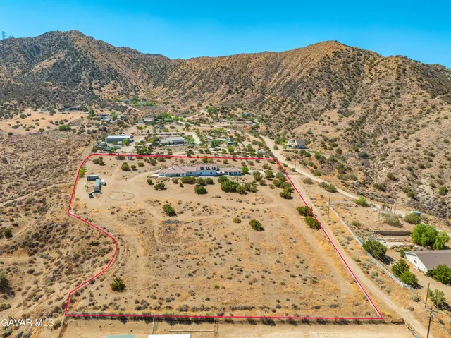 a view of a house with a mountain