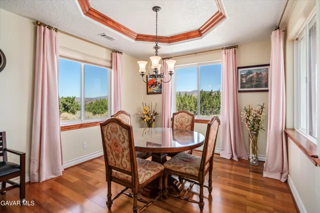 a bathroom with a sink a toilet a mirror and shower