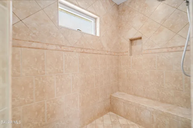 a room with pool table and windows