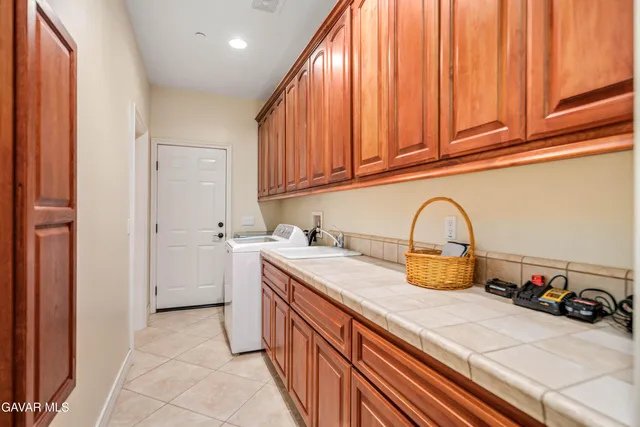 a kitchen with stainless steel appliances granite countertop a sink and a stove