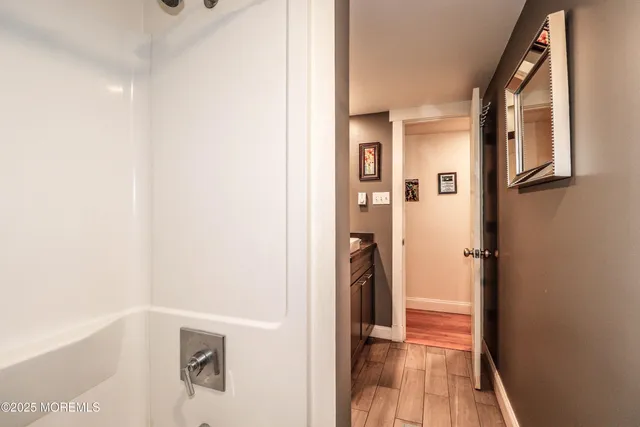 a view of a hallway with a white walls