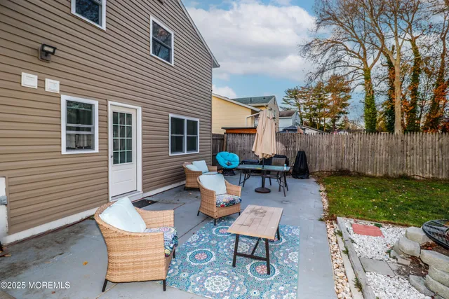 a view of a backyard with sitting area