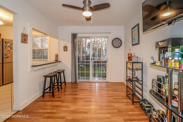 a view of a room with furniture and a window