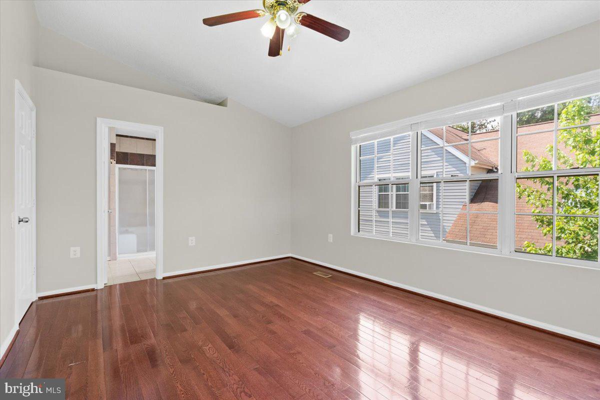461 Foxridge Drive Southwest Leesburg, VA 20175 - Photo 13 of 25 a view of an empty room with a window and wooden floor