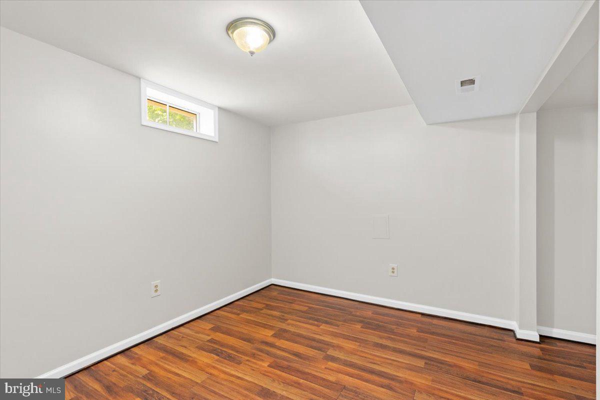 461 Foxridge Drive Southwest Leesburg, VA 20175 - Photo 21 of 25 a view of an empty room with wooden floor and a window