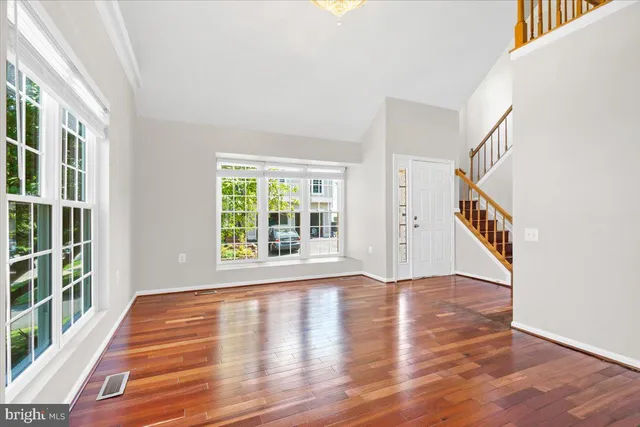 a view of an entryway with wooden floor
