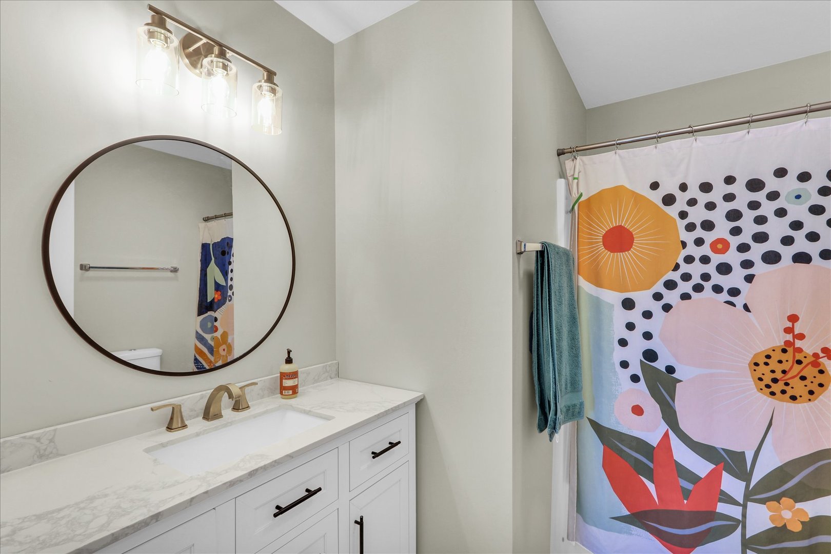 2402 Windward Boulevard, Unit 209 Champaign, IL 61821 - Photo 23 of 33 a bathroom with a mirror sink and mirror