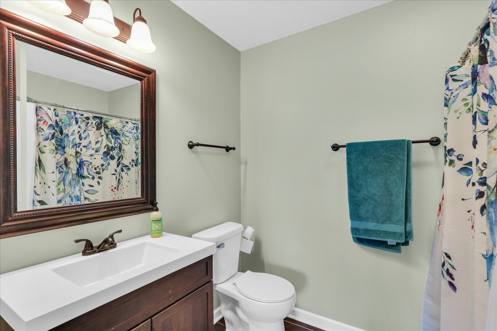 2402 Windward Boulevard, Unit 209 Champaign, IL 61821 - Photo 25 of 33 a bathroom with a sink mirror and toilet