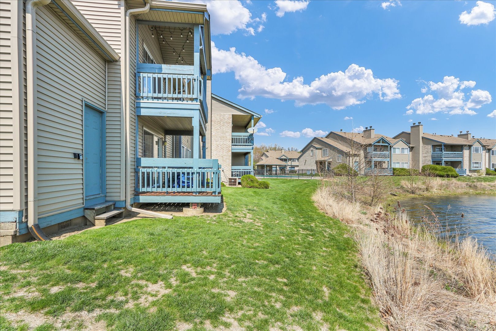 2402 Windward Boulevard, Unit 209 Champaign, IL 61821 - Photo 28 of 33 a view of front of a house with a yard