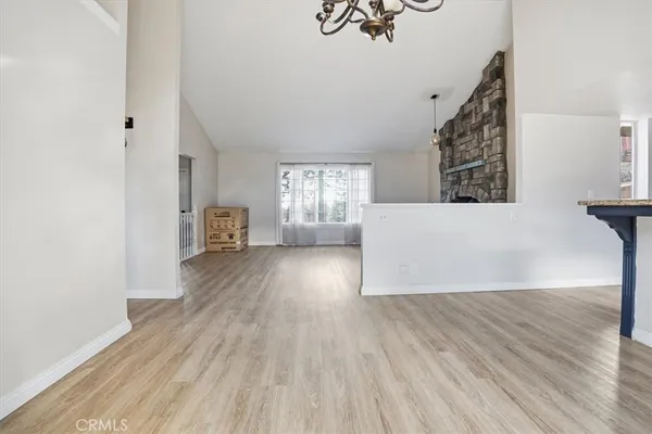 a kitchen with stainless steel appliances granite countertop a sink stove and wooden floor
