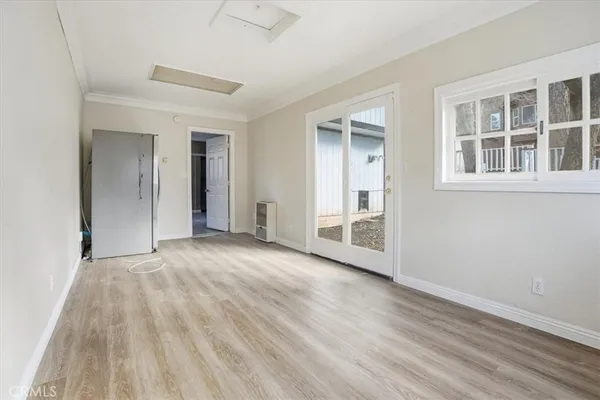 a kitchen with stainless steel appliances granite countertop a sink a stove and a refrigerator