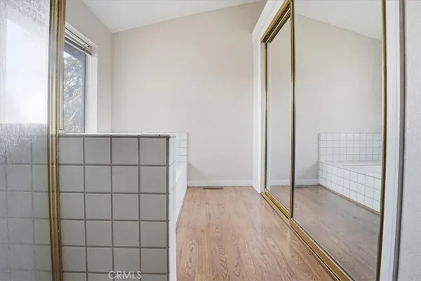 a view of a chairs and fire pit in the backyard
