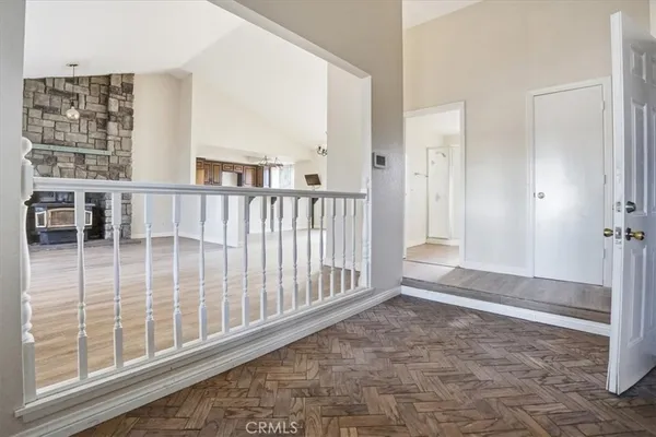 an empty room with furniture and a fireplace