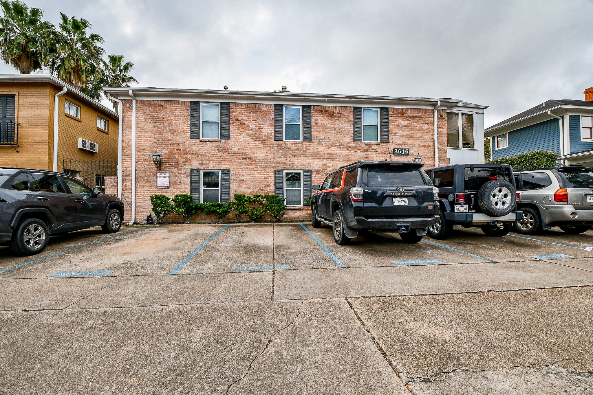 a view of a car parked in front of a house