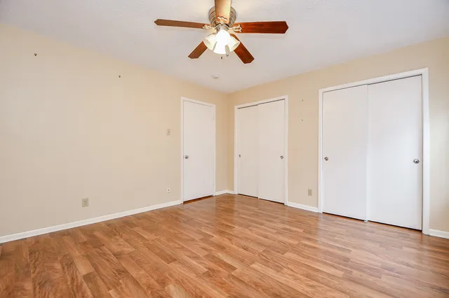 a kitchen with granite countertop a stove sink and cabinets