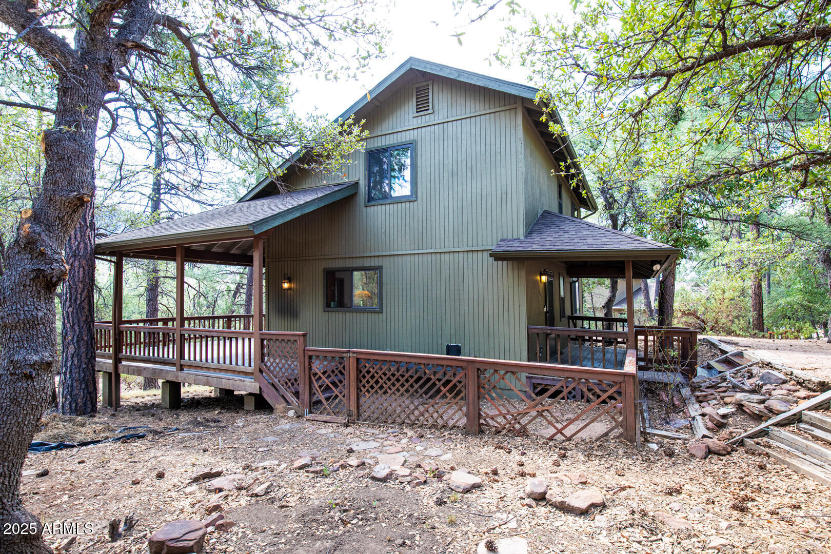 5115 Monte Vista Pine, AZ 85544 - Photo 29 of 35 a front view of a house with garden and seating area