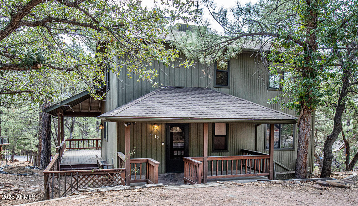 5115 Monte Vista Pine, AZ 85544 - Photo 3 of 35 a front view of a house with garden