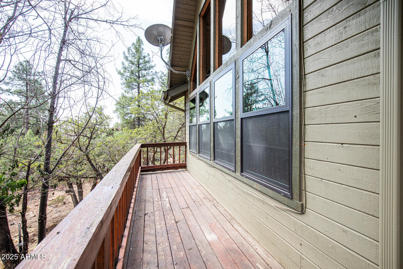 5115 Monte Vista Pine, AZ 85544 - Photo 33 of 35 a view of balcony with wooden floor and fence