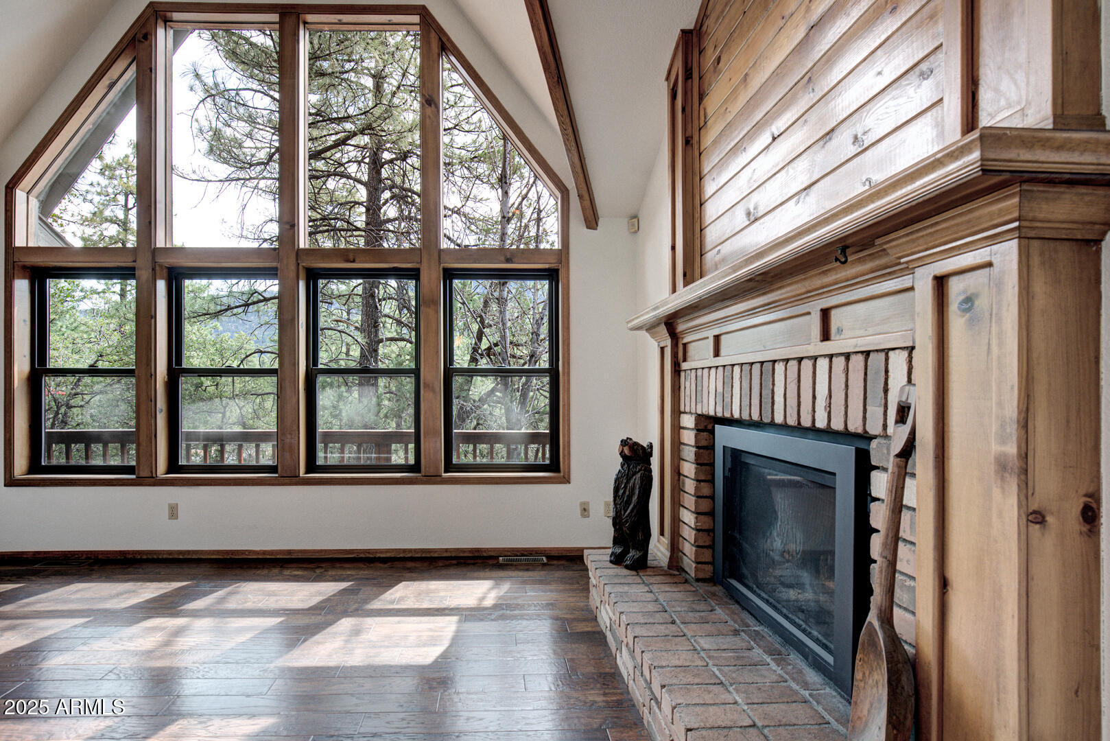 5115 Monte Vista Pine, AZ 85544 - Photo 9 of 35 a view of an empty room with a fireplace and a window