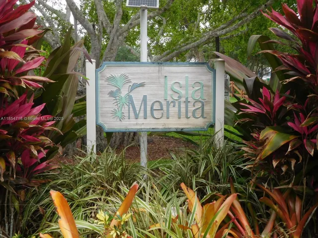 a sign that is on a brick wall