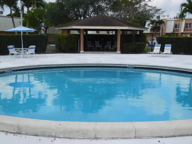 a view of pool table and chairs