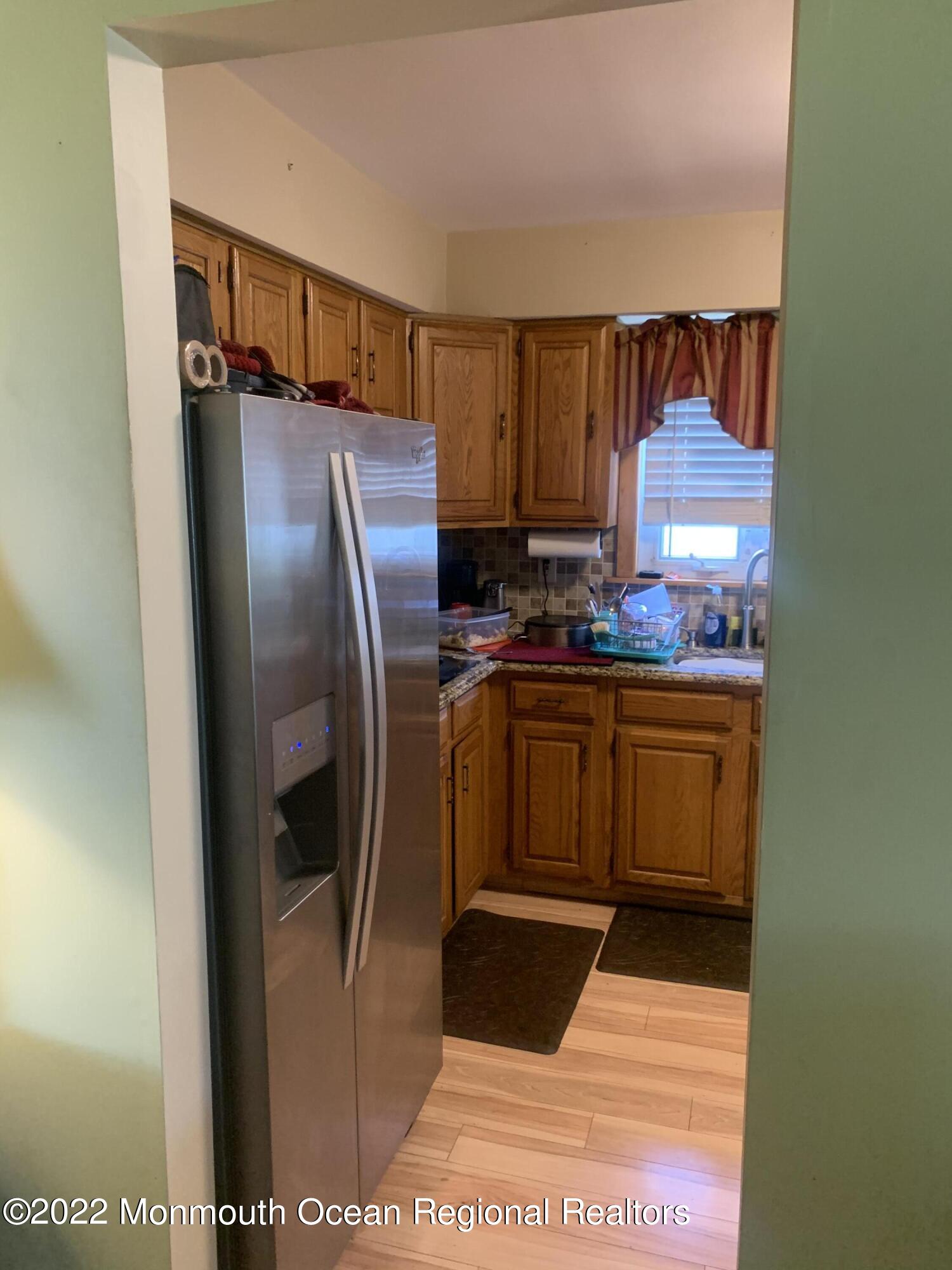 10 Phillips Road Brick, NJ 08724 - Photo 17 of 26 a kitchen with stainless steel appliances a refrigerator and a stove