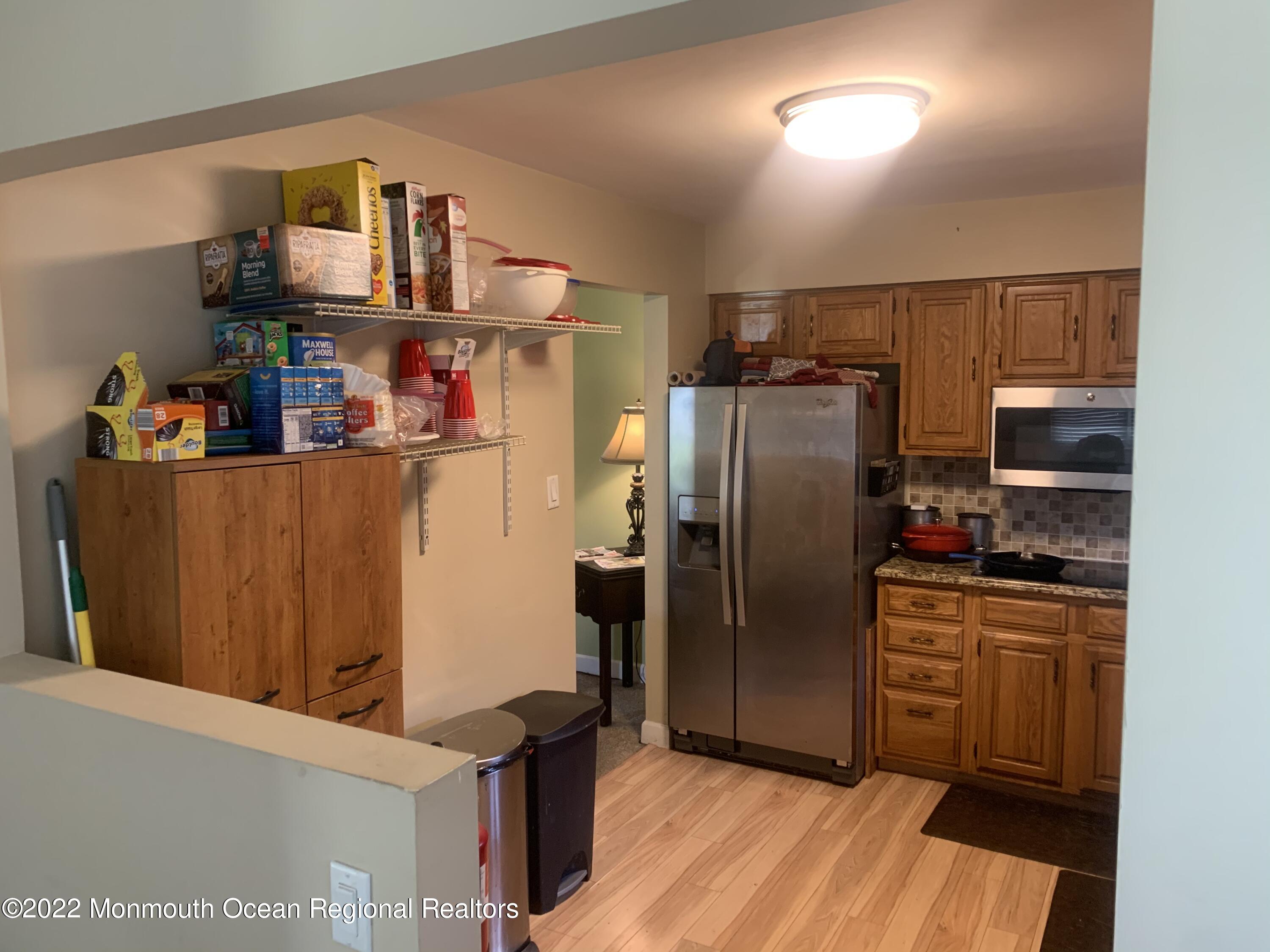 10 Phillips Road Brick, NJ 08724 - Photo 20 of 26 a kitchen with refrigerator and cabinets