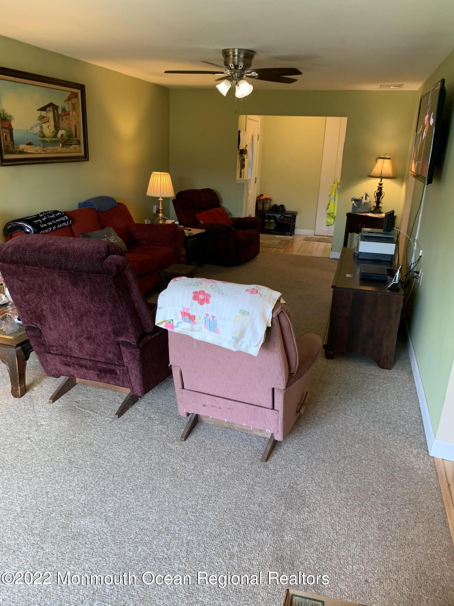 10 Phillips Road Brick, NJ 08724 - Photo 3 of 26 a living room with furniture and a flat screen tv