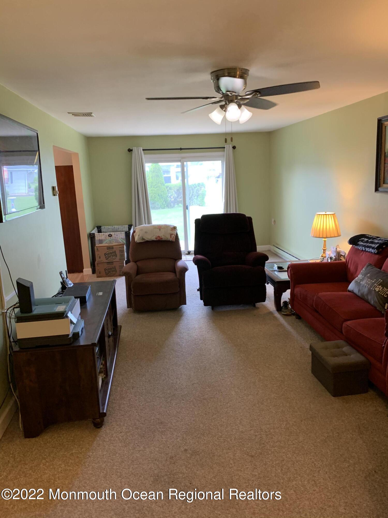 10 Phillips Road Brick, NJ 08724 - Photo 5 of 26 a living room with furniture and a flat screen tv