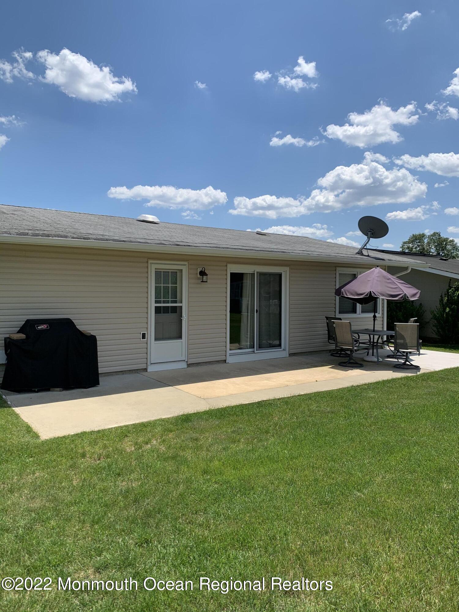 10 Phillips Road Brick, NJ 08724 - Photo 10 of 26 a view of a house with a yard and sitting area
