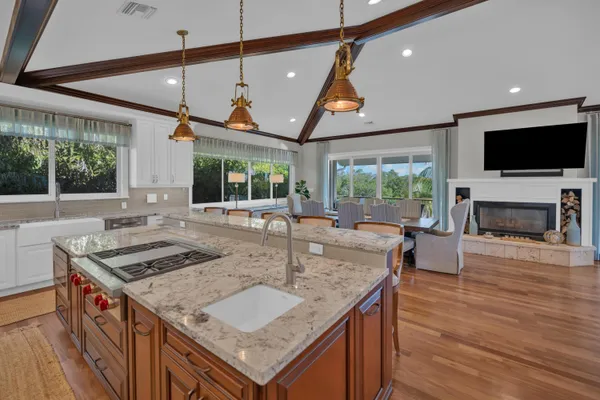 a view of a livingroom with wooden floor and a flat screen tv