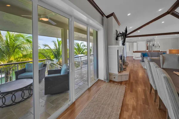 a view of a dining room with furniture wooden floor and chandelier