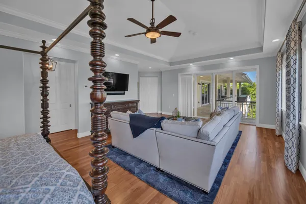 a bedroom with bed and a large window