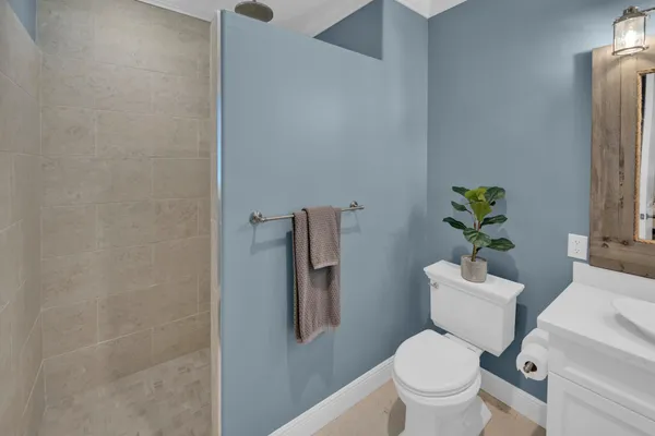 a bedroom with two beds and window