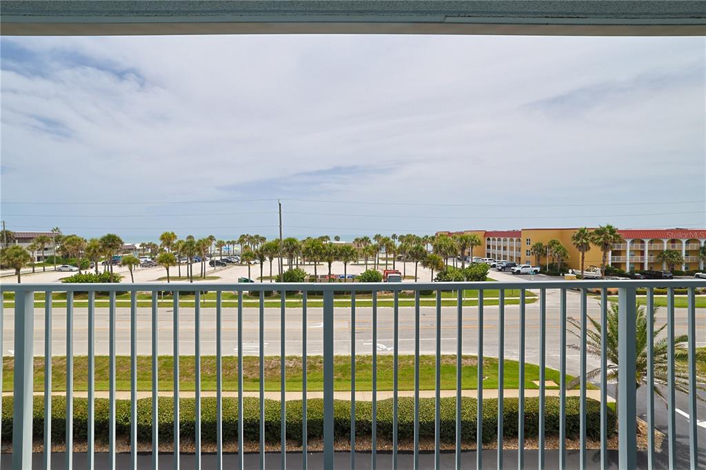 3700 South Atlantic Avenue, Unit 414 New Smyrna Beach, FL 32169 - Photo 17 of 30 a view of a balcony with city