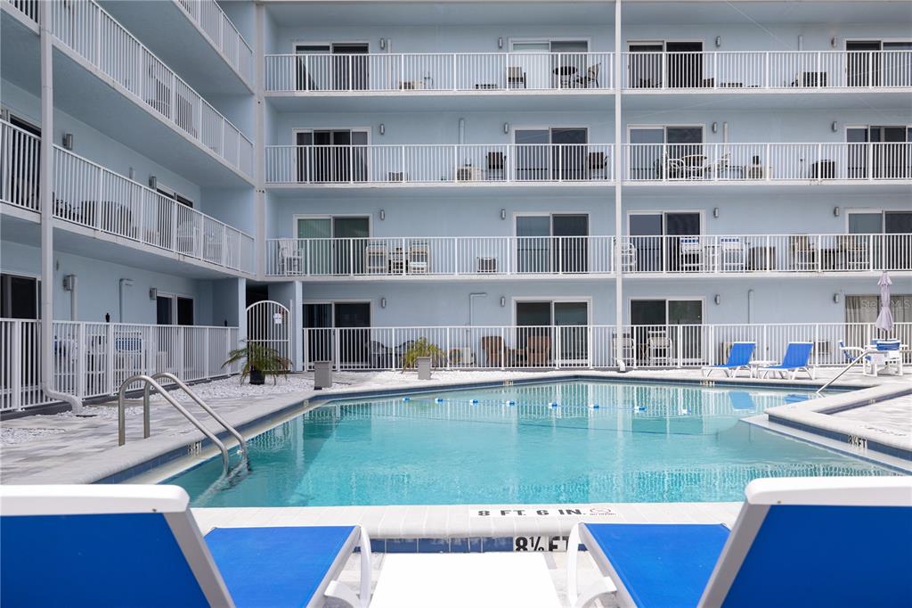 3700 South Atlantic Avenue, Unit 414 New Smyrna Beach, FL 32169 - Photo 5 of 30 a view of pool with outdoor seating