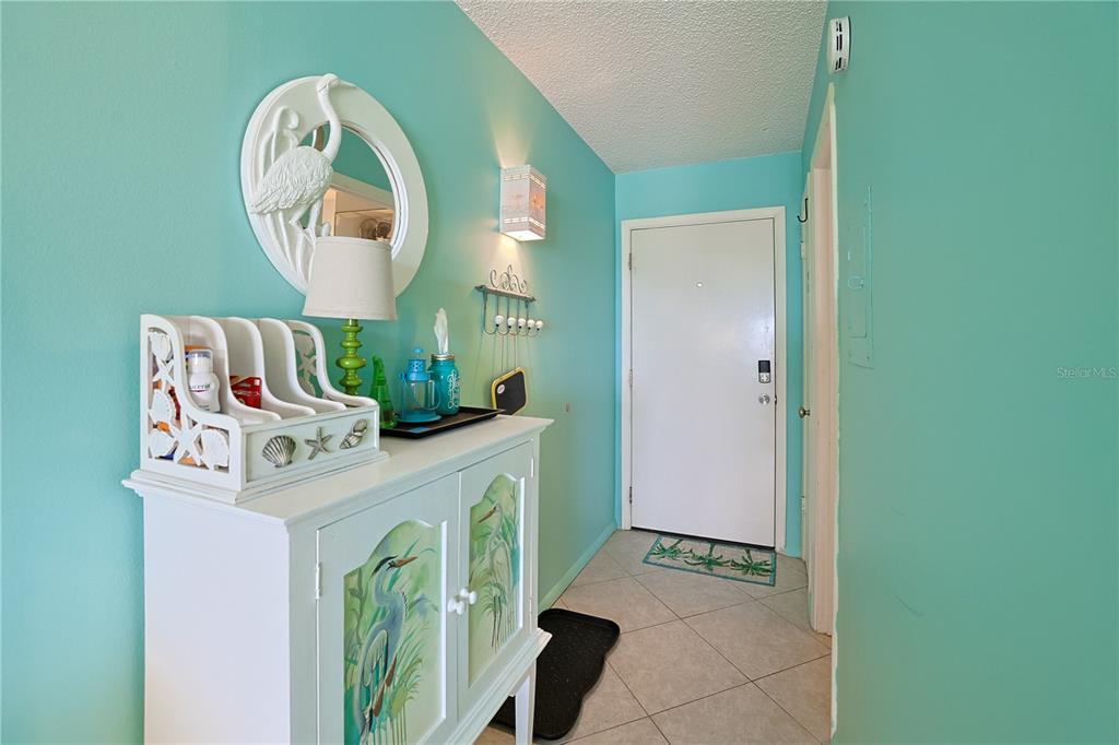 3700 South Atlantic Avenue, Unit 414 New Smyrna Beach, FL 32169 - Photo 8 of 30 a view of a hallway with entryway