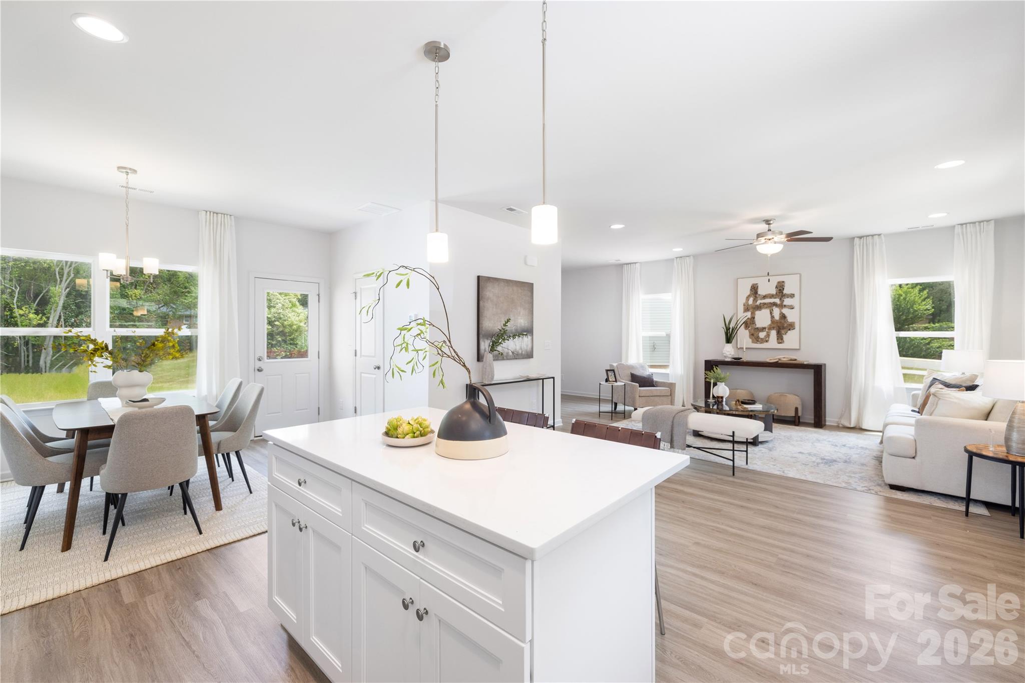 5514 Anderson Road Charlotte, NC 28269 - Photo 19 of 20 a view of a dining room with furniture a chandelier and wooden floor