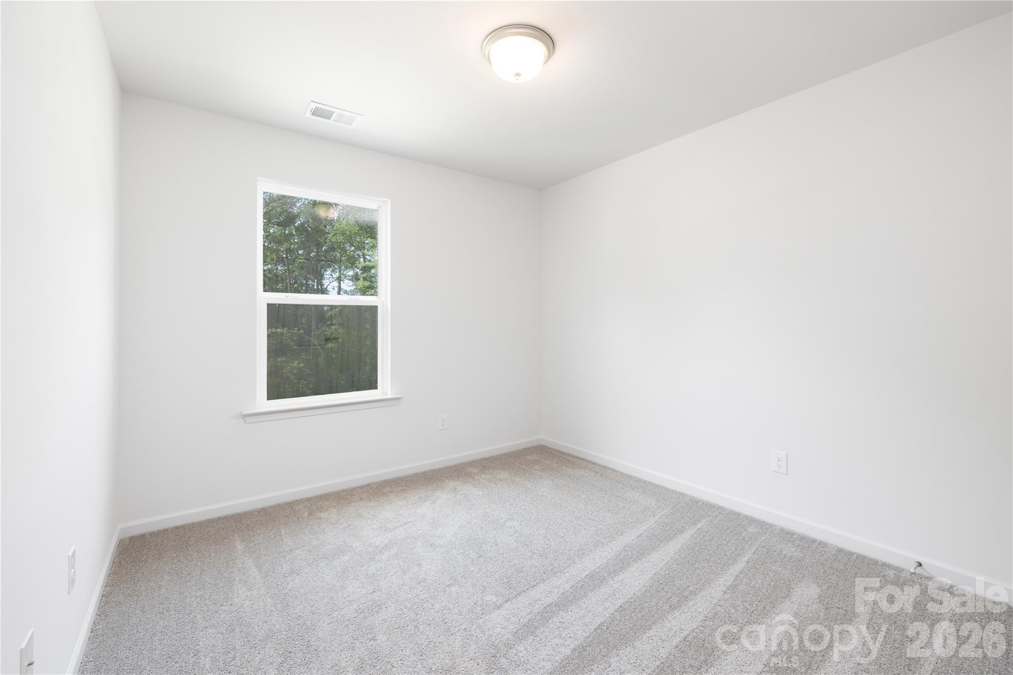 5514 Anderson Road Charlotte, NC 28269 - Photo 3 of 20 an empty room with windows