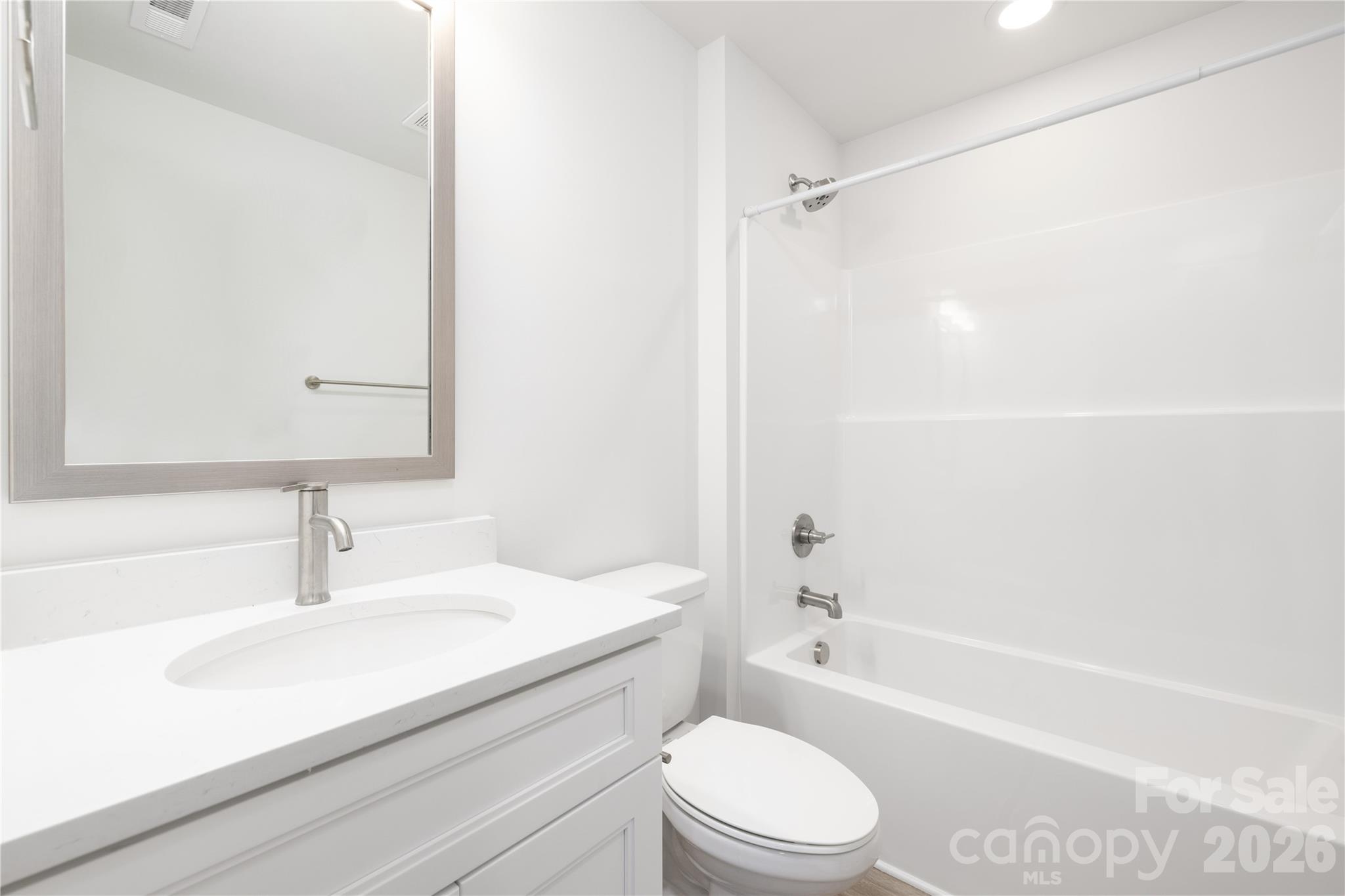 5514 Anderson Road Charlotte, NC 28269 - Photo 7 of 20 a bathroom with a sink a toilet and a bathtub