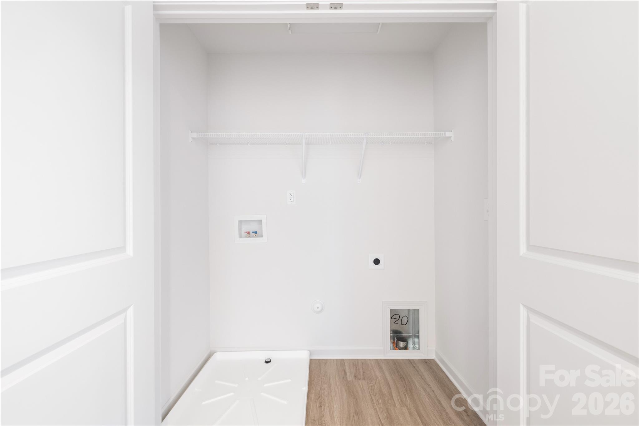 5514 Anderson Road Charlotte, NC 28269 - Photo 8 of 20 a view of a room with a closet and wooden floor