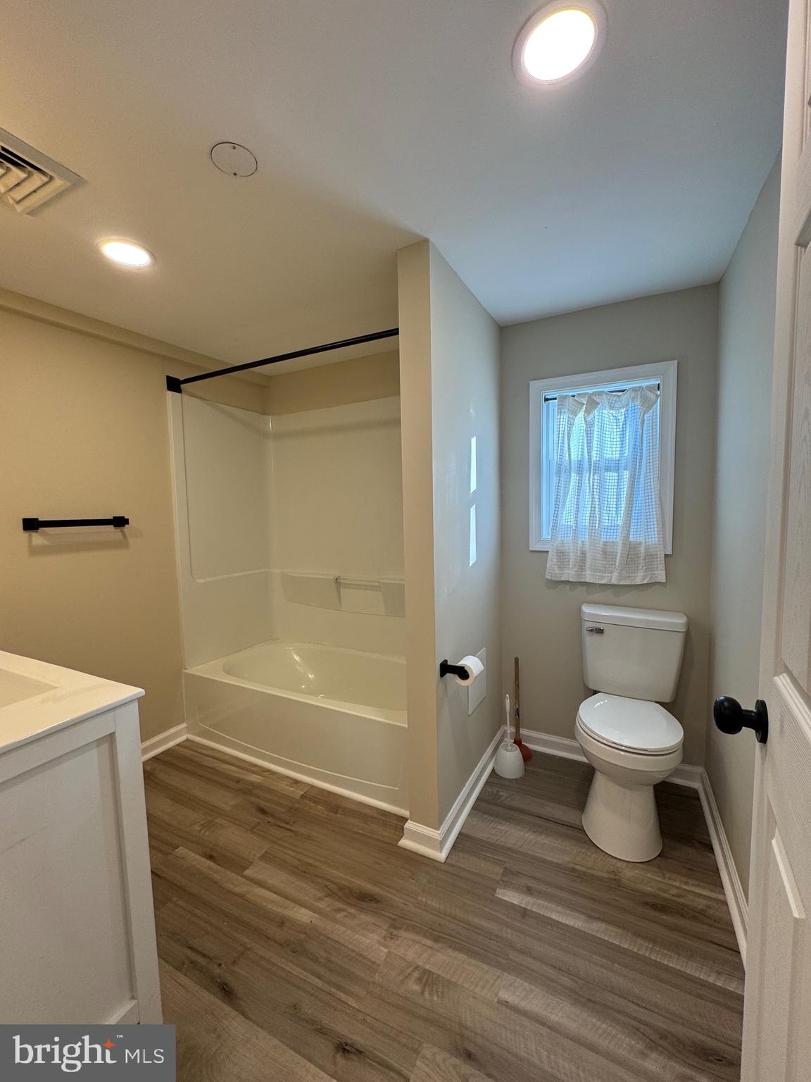2389 White Oak Road Dover, DE 19901 - Photo 15 of 25 a bathroom with a toilet a sink and a bathtub
