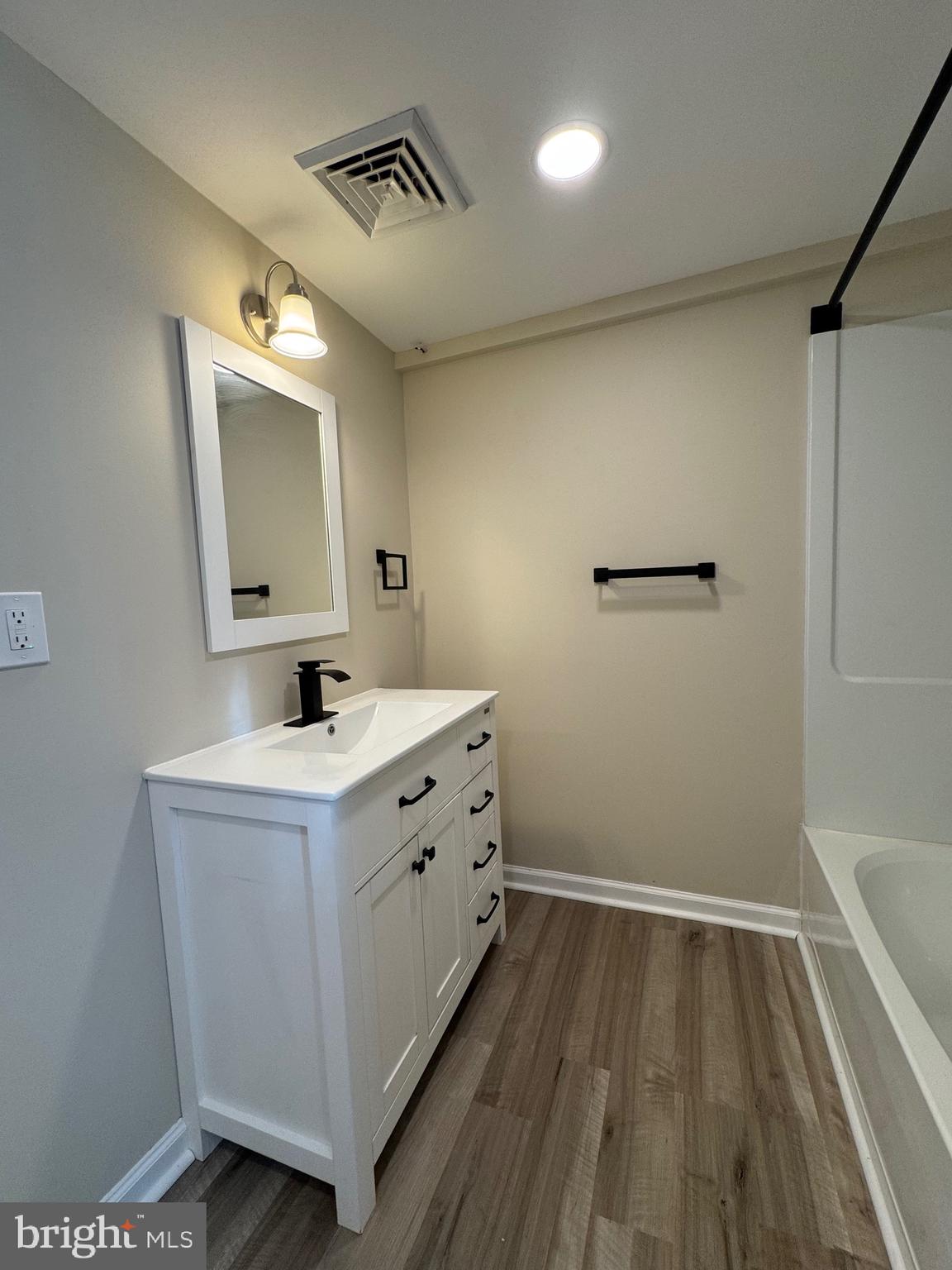 2389 White Oak Road Dover, DE 19901 - Photo 16 of 25 a bathroom with a sink and mirror