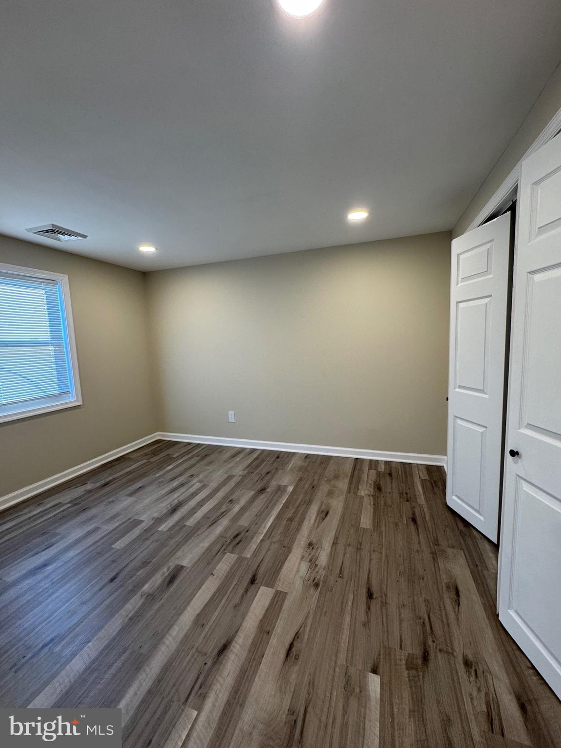 2389 White Oak Road Dover, DE 19901 - Photo 17 of 25 an empty room with wooden floor and entrance