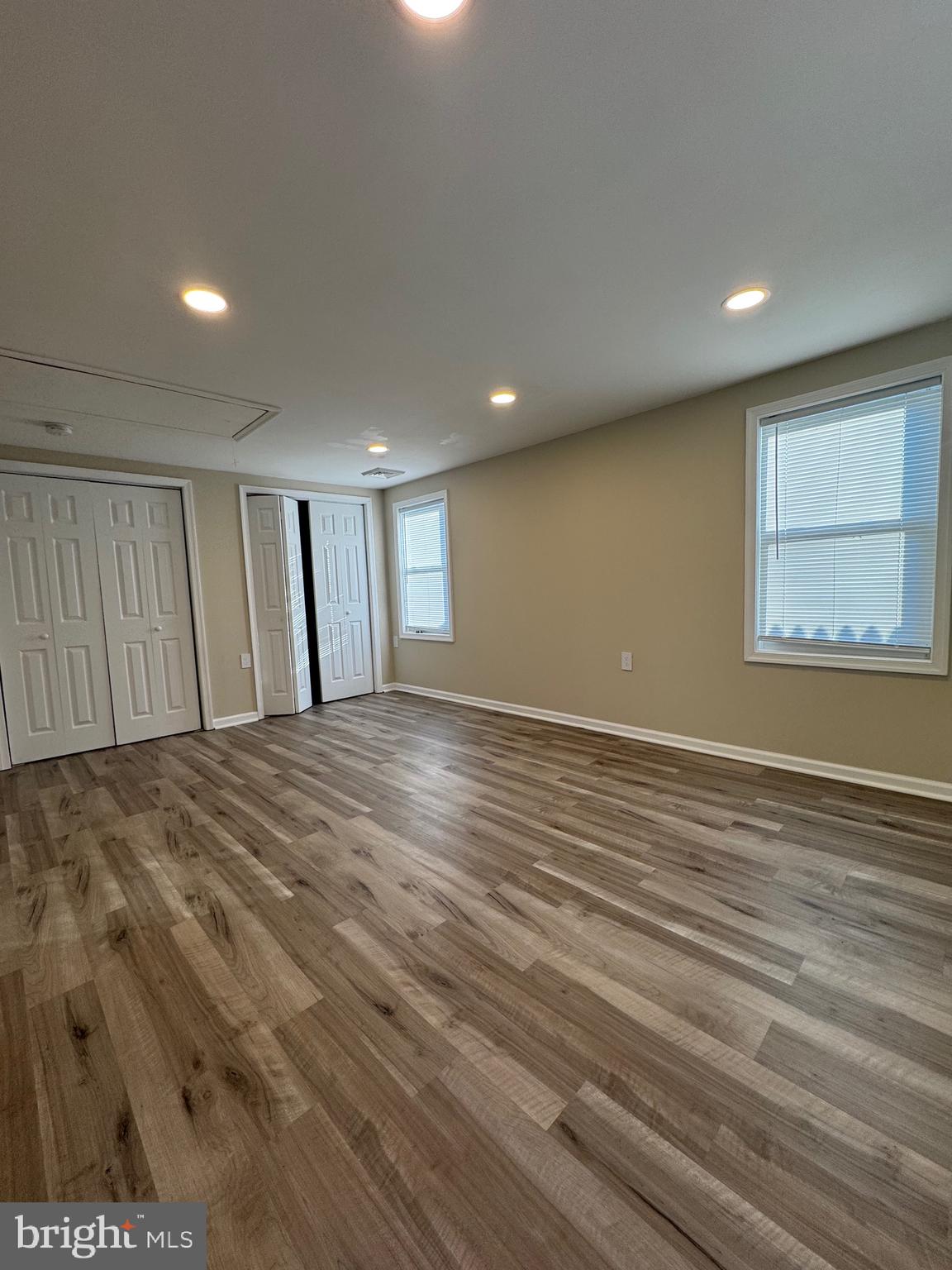 2389 White Oak Road Dover, DE 19901 - Photo 23 of 25 an empty room with wooden floor and windows
